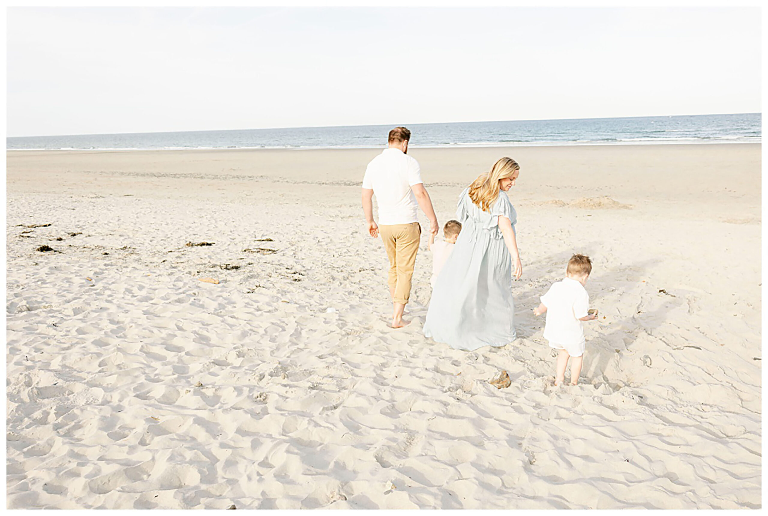 Family walking on Hampton Beach in NH thinking of birthing centers New Hampshire has to offer. 