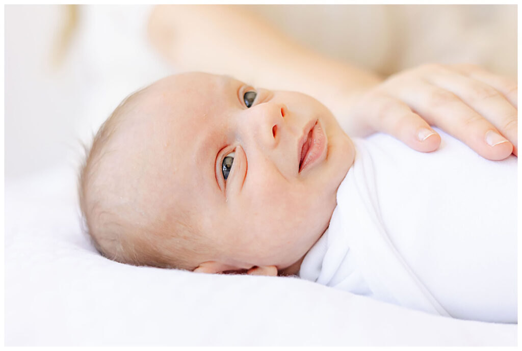 Up close shot of swaddled newborn during session with Manchester NH Photographer, Kathleen Jablonski 