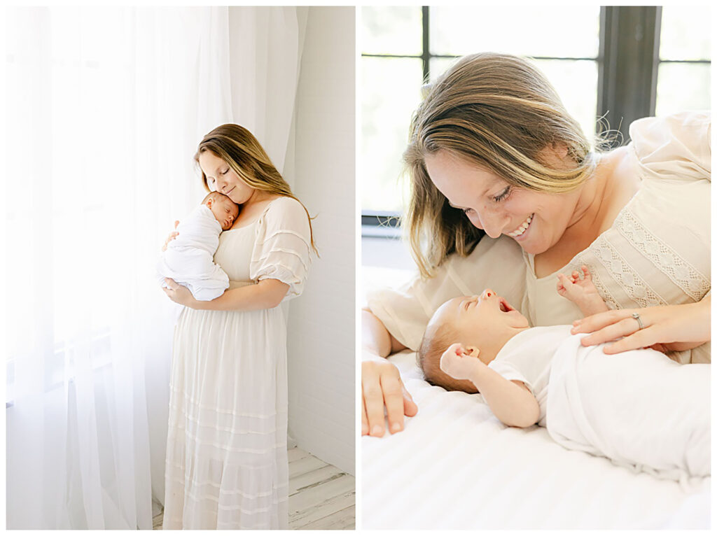 Mother snuggles newborn baby dressed in white swaddle while he yawns during studio session with Manchester NH Photographer.
